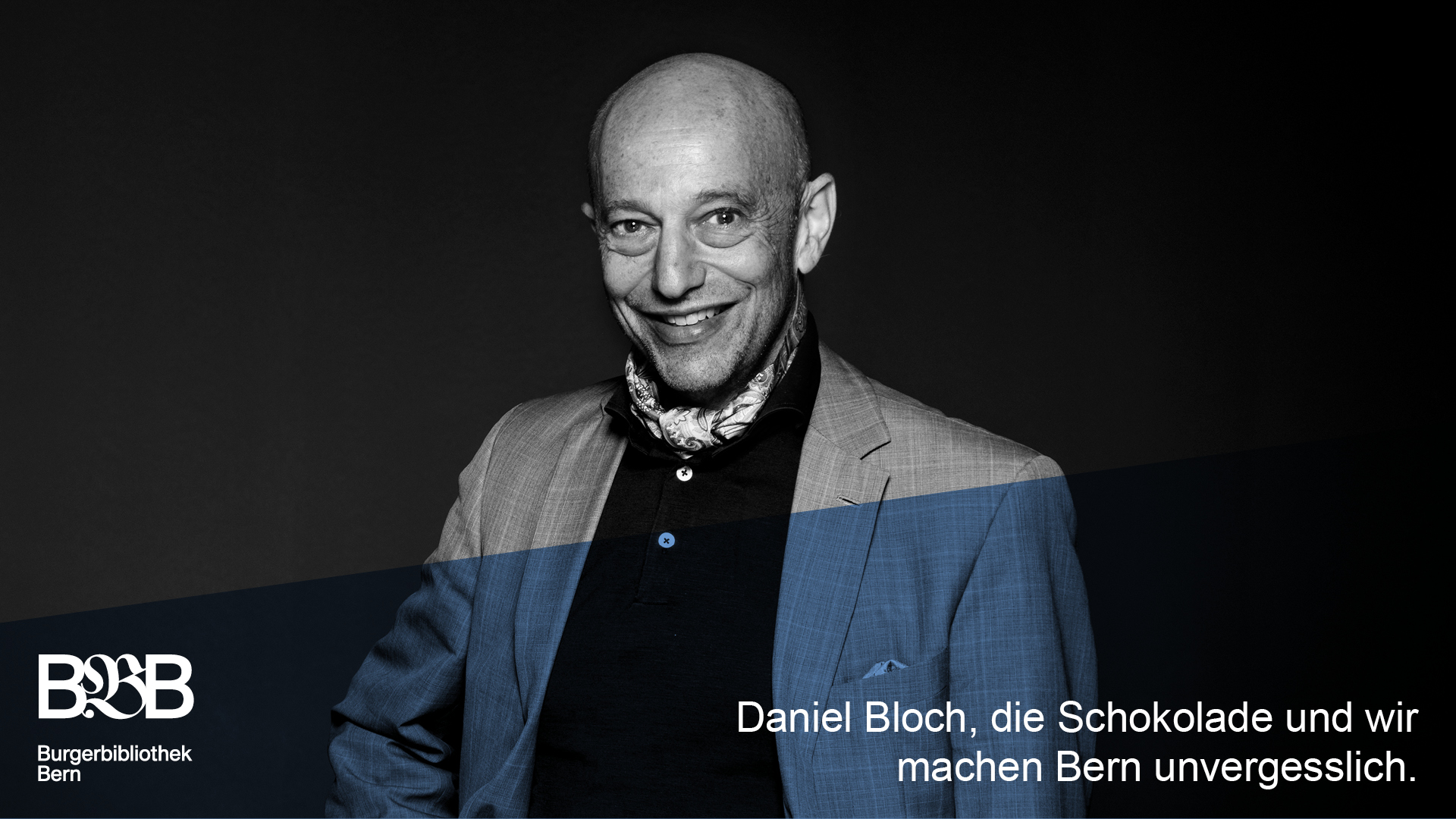 Portraitfoto Daniel Bloch. Text: Daniel Bloch, die Schokolade und wir machen Bern unvergesslich.